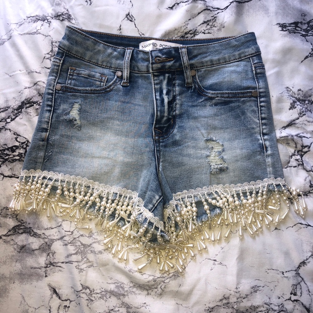 Denim shorts with lace and beading at the bottom